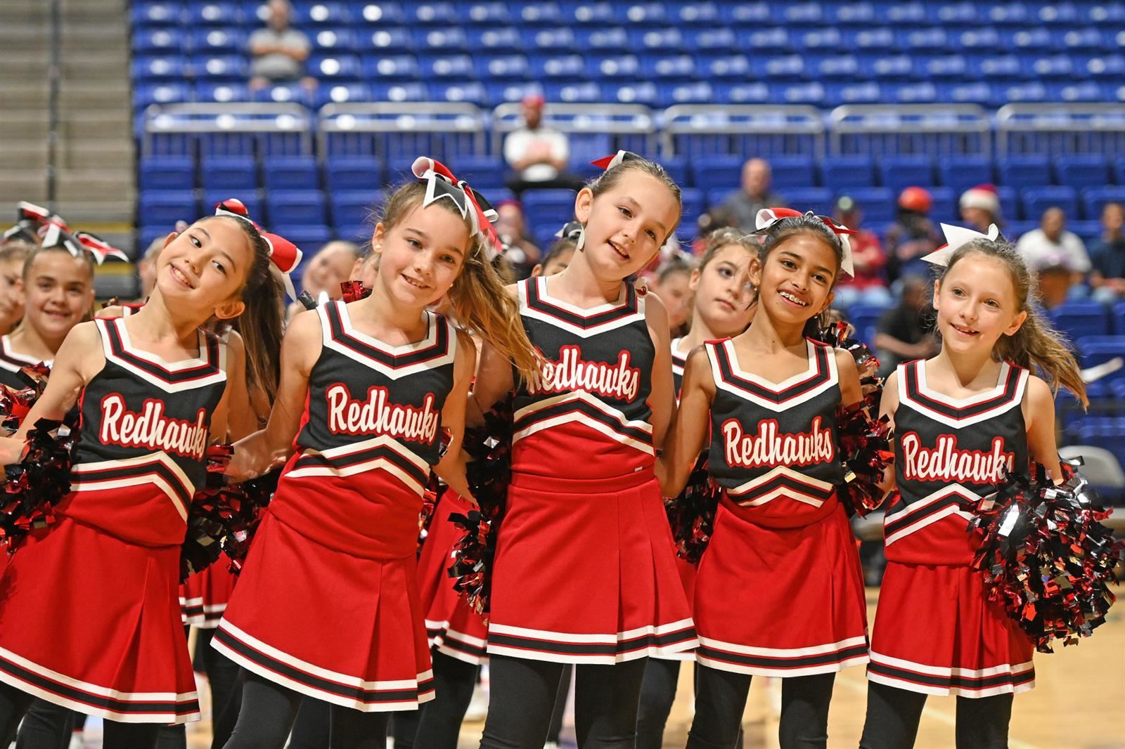 Members of the Rennell Elementary School cheer squad perform at the 13th annual Houston Methodist Cy-Hoops Invitational.